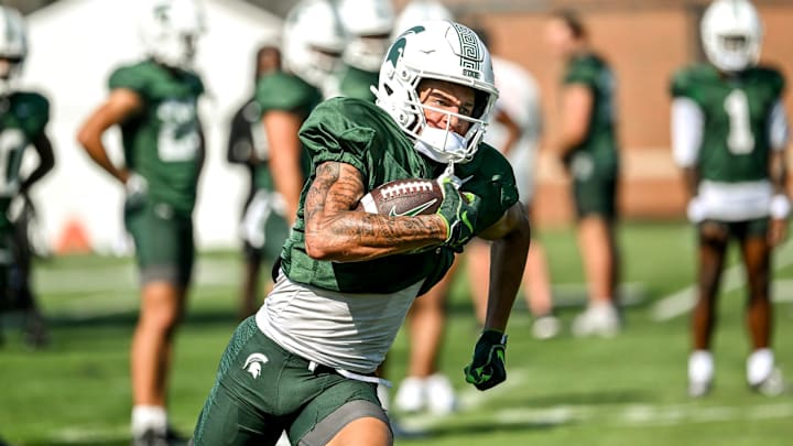 Michigan State's Braylon Collier runs with the ball during football practice on Monday, Aug. 11, 2025, in East Lansing.