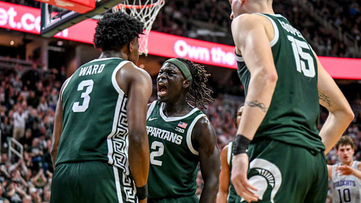Michigan State's Kur Teng, center, celebrates with Cam Ward after Ward's score and a Northwestern foul during the second half on Thursday, Jan. 8, 2026, at the Breslin Center in East Lansing.