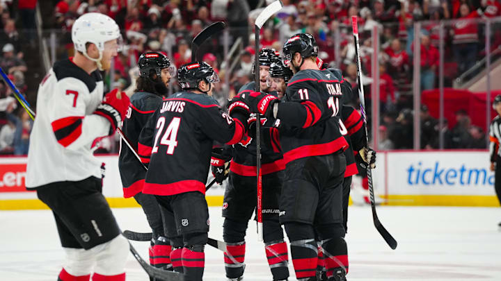 Carolina Hurricanes center Seth Jarvis (24) celebrates his empty net goal: James Guillory-Imagn Images