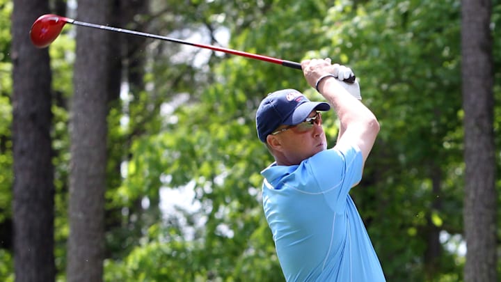Then Ole Miss coach Hugh Freeze tees off during a tournament in 2013. 