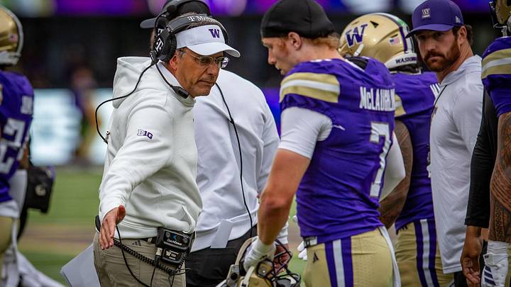 Alex McLaughlin gets a congratulatory hand slap from coach Jedd Fisch after his Utah State interception. Alex McLaughlin gets a congratulatory hand slap from coach Jedd Fisch after his Utah State interception.