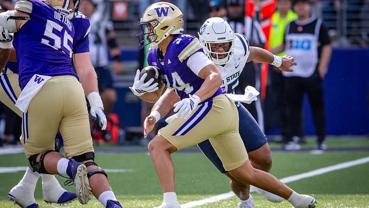 Brian Bonner Jr. looks for room to run against Utah State. Brian Bonner Jr. looks for room to run against Utah State.