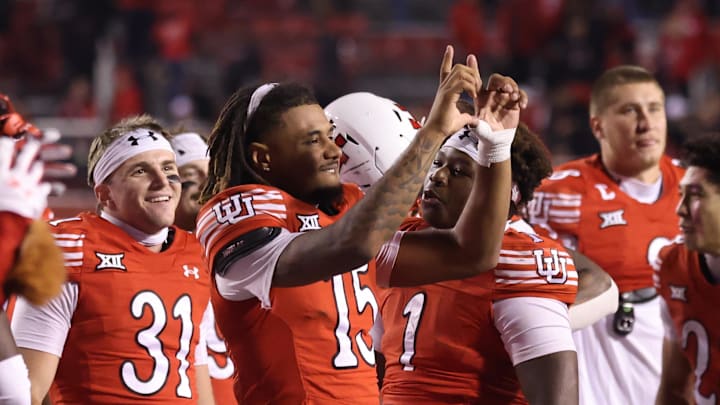 Utah Utes quarterback Byrd Ficklin (15) celebrates a win against the Colorado Buffaloes after the game at Rice-Eccles Stadium.