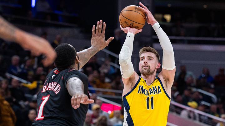 Apr 10, 2026; Indianapolis, Indiana, USA; Indiana Pacers center Micah Potter (11) shoots for the basket against Philadelphia 76ers center Andre Drummond (1) during the first half at Gainbridge Fieldhouse. Mandatory Credit: Trevor Ruszkowski-Imagn Images