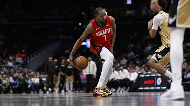 Mar 2, 2026; Washington, District of Columbia, USA; Houston Rockets forward Kevin Durant (7) dribbles the ball as Washington Wizards forward Justin Champagnie (9) defends in the second half at Capital One Arena. Mandatory Credit: Geoff Burke-Imagn Images