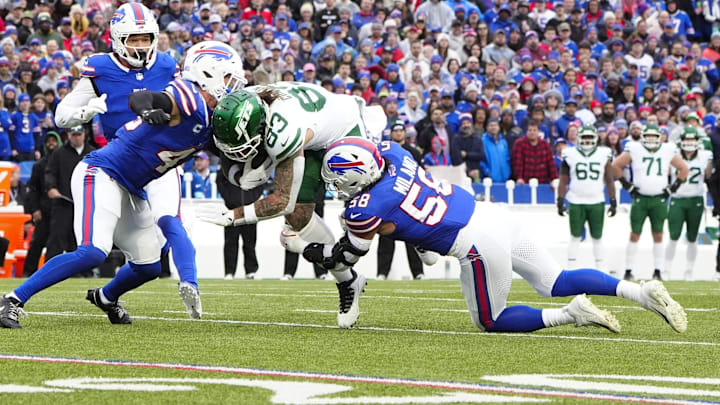 Dec 29, 2024; Orchard Park, New York, USA; Buffalo Bills linebackers Terrel Bernard (43) and Matt Milano (58) tackle New York Jets tight end Tyler Conklin (83). Dec 29, 2024; Orchard Park, New York, USA; Buffalo Bills linebackers Terrel Bernard (43) and Matt Milano (58) tackle New York Jets tight end Tyler Conklin (83).