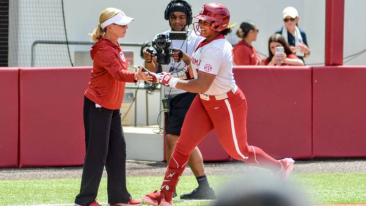 Oklahoma utility Ella Parker high-fives Patty Gasso after hitting a home run against Binghamton. Oklahoma utility Ella Parker high-fives Patty Gasso after hitting a home run against Binghamton.