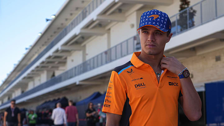 McLaren driver Lando Norris walks through the paddock area to a media interview at Circuit of McLaren driver Lando Norris walks through the paddock area to a media interview at Circuit of