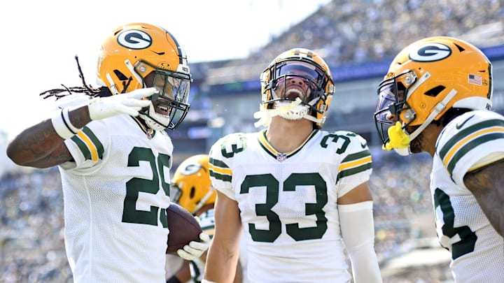Green Bay Packers safety Xavier McKinney (29) celebrates an interception with safety Evan Williams (33) at Jacksonville.