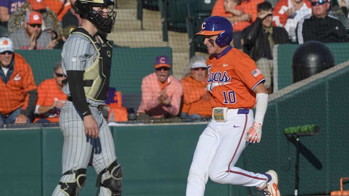 Clemson outfieler Cam Cannarella (10) scores against Wake Forest University during the bottom of the first inning at Doug Kingsmore Stadium in Clemson, S.C. Friday, March 21, 2025. Clemson outfieler Cam Cannarella (10) scores against Wake Forest University during the bottom of the first inning at Doug Kingsmore Stadium in Clemson, S.C. Friday, March 21, 2025.