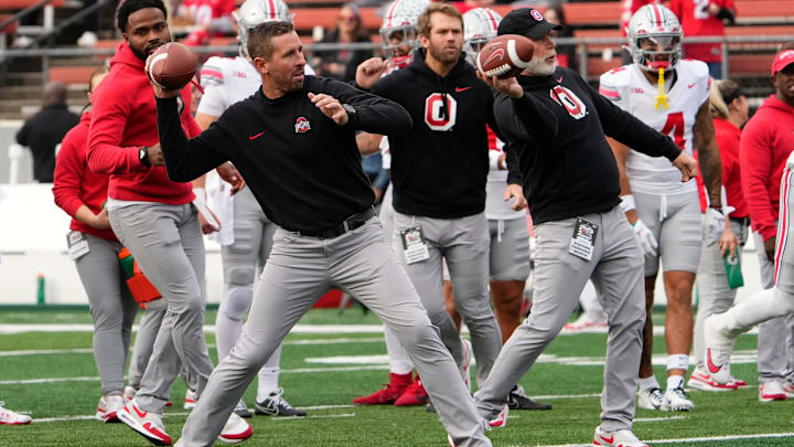 Nov 4, 2023; Piscataway, New Jersey, USA; Ohio State Buckeyes offensive coordinator Brian Hartline and defensive coordinator Jim Knowles warm up players during the NCAA football game against the Rutgers Scarlet Knights at SHI Stadium. Ohio State won 35-16.