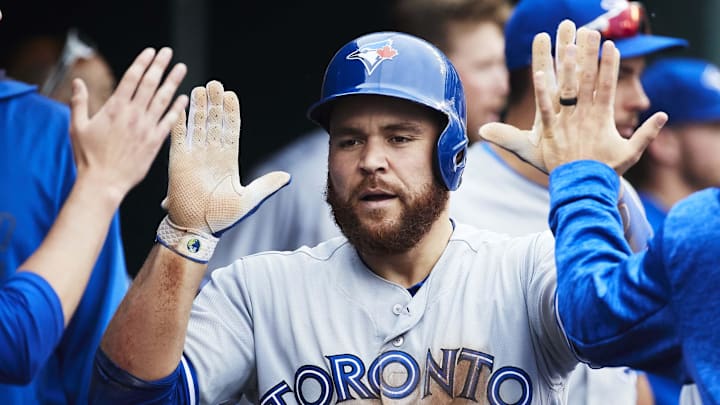 Jun 3, 2018; Detroit, MI, USA; Toronto Blue Jays catcher Russell Martin (55) is congratulated by teammates after scoring in the seventh inning against the Detroit Tigers at Comerica Park. Jun 3, 2018; Detroit, MI, USA; Toronto Blue Jays catcher Russell Martin (55) is congratulated by teammates after scoring in the seventh inning against the Detroit Tigers at Comerica Park.