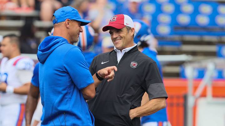 Florida head coach Jon Sumrall, left, and South Carolina head coach Shane Beamer chat at mid field  during warm ups before an NCAA football at Steve Spurrier Field at Ben Hill Griffin Stadium in Gainesville, FL on Saturday, October 10, 2026. [Alan Youngblood/Gainesville Sun]