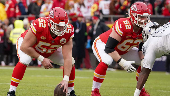Dec 25, 2023; Kansas City, Missouri, USA; Kansas City Chiefs center Creed Humphrey (52) and guard Joe Thuney (62) at the line of scrimmage against the Las Vegas Raiders during the game at GEHA Field at Arrowhead Stadium. Mandatory Credit: Denny Medley-USA TODAY Sports