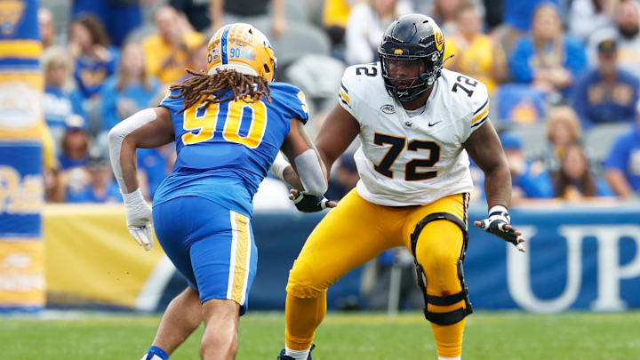 Oct 12, 2024; Pittsburgh, Pennsylvania, USA; California Golden Bears offensive lineman T.J. Session (72) blocks at the line of scrimmage against Pittsburgh Panthers defensive lineman Sincere Edwards (90) during the first quarter at Acrisure Stadium. Mandatory Credit: Charles LeClaire-Imagn Images Oct 12, 2024; Pittsburgh, Pennsylvania, USA; California Golden Bears offensive lineman T.J. Session (72) blocks at the line of scrimmage against Pittsburgh Panthers defensive lineman Sincere Edwards (90) during the first quarter at Acrisure Stadium. Mandatory Credit: Charles LeClaire-Imagn Images