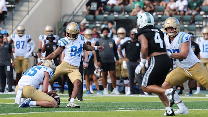 Aug 31, 2024; Honolulu, Hawaii, USA; UCLA Bruins place kicker Mateen Bhaghani (94) makes a field goal against the Hawaii Rainbow Warriors during the third quarter of an NCAA college football game against the UCLA Bruins at the Clarence T.C. Ching Athletics Complex. Mandatory Credit: Marco Garcia-Imagn Images