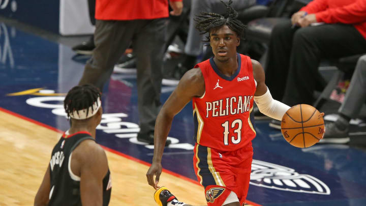 Jan 30, 2021; New Orleans, Louisiana, USA; New Orleans Pelicans guard Kira Lewis Jr. (13) is defended by Houston Rockets forward Danuel House Jr. (4) in the fourth quarter at the Smoothie King Center. Mandatory Credit: Chuck Cook-USA TODAY Sports
