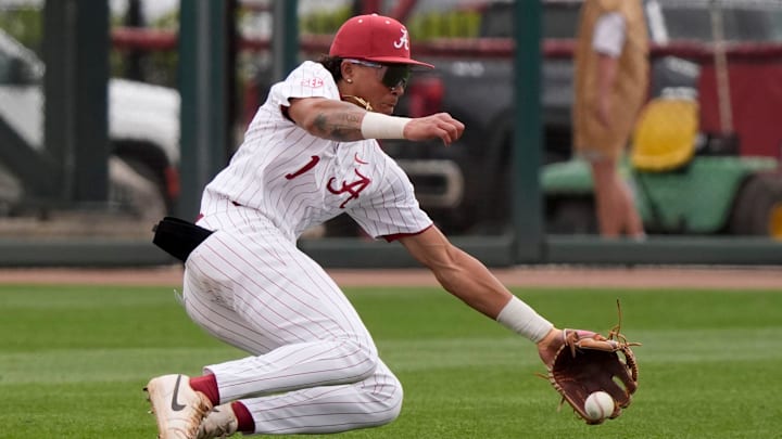 Mar 29, 2025; Tuscaloosa, AL, USA; Alabama shortstop Justin Lebron (1) goes deep in the hole behind second to field a ball hit up the middle but was unable to throw to first in time for an out during the game with Oklahoma at Sewell-Thomas Stadium. Oklahoma evened the series with a 6-5 win.