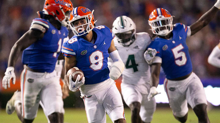 Florida Gators cornerback Jalen Kimber (8) runs back a pick six in the first half agains the USF