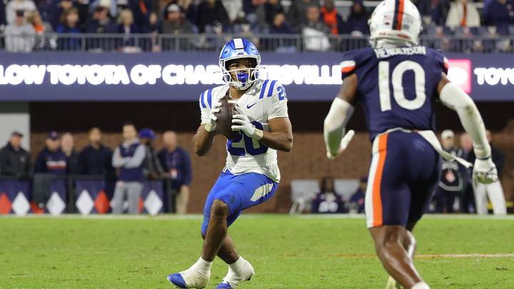 Oct 23, 2026; Charlottesville, Virginia, USA; Duke Blue Devils running back Nate Sheppard (20) throws the game-winning touchdown pass against the Virginia Cavaliers during the second half at Scott Stadium. Mandatory Credit: Amber Searls-Imagn Images