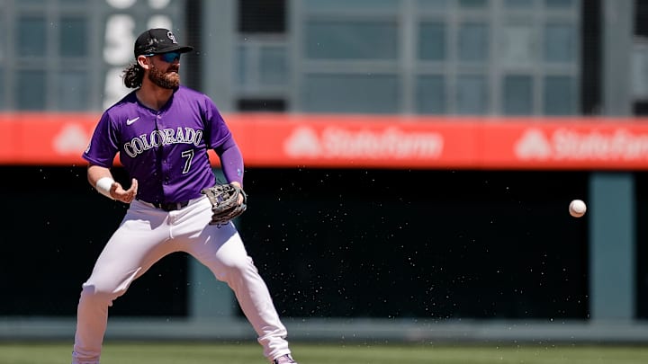 Aug 29, 2024; Denver, Colorado, USA; Colorado Rockies second baseman Brendan Rodgers (7) reacts as he loses track of a fly ball in the third inning against the Miami Marlins at Coors Field.
