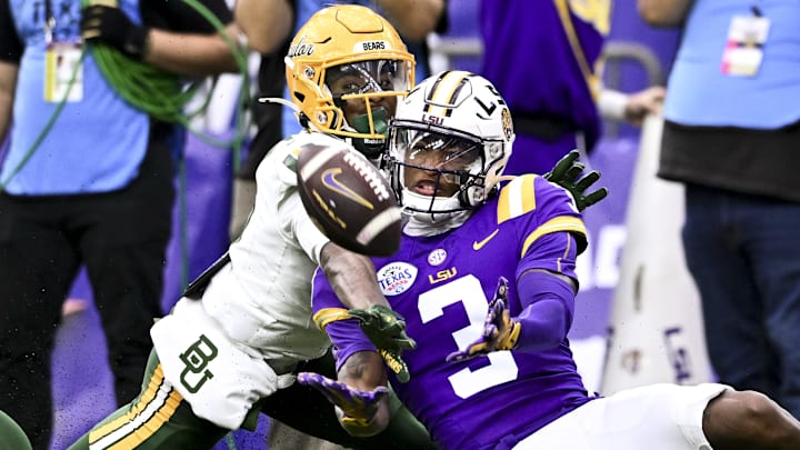 Baylor Bears cornerback Caden Jenkins (8) breaks up a pass intended for LSU Tigers wide receiver Chris Hilton Jr. (3)