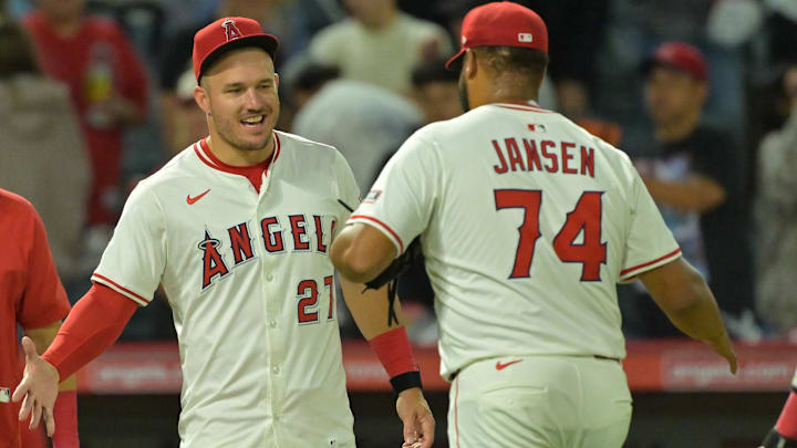 Jul 28, 2025; Anaheim, California, USA; Los Angeles Angels relief pitcher Kenley Jansen (74) is congratulated by designated hitter Mike Trout (27) after earning a save in the ninth inning against the Texas Rangers at Angel Stadium. Mandatory Credit: Jayne Kamin-Oncea-Imagn Images Jul 28, 2025; Anaheim, California, USA; Los Angeles Angels relief pitcher Kenley Jansen (74) is congratulated by designated hitter Mike Trout (27) after earning a save in the ninth inning against the Texas Rangers at Angel Stadium. Mandatory Credit: Jayne Kamin-Oncea-Imagn Images