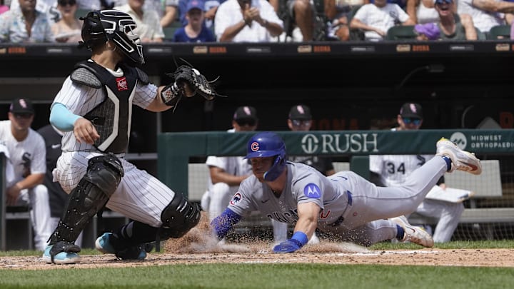 Chicago Cubs second baseman Nico Hoerner (2) slides safely into home plate at Rate Field. 
