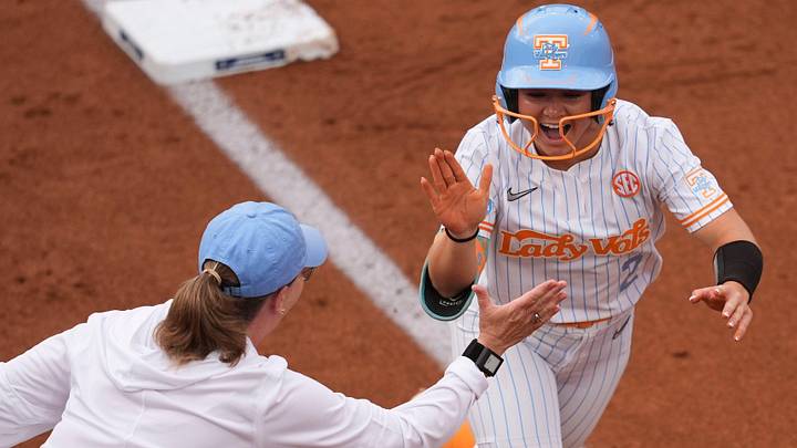 Tennessee's Sophia Knight (2) celebrates with coach Karen Weekly after hitting a home run against Georg in the NCAA college softball super regional on May 21, 2026, in Knoxville, Tennessee. Tennessee's Sophia Knight (2) celebrates with coach Karen Weekly after hitting a home run against Georg in the NCAA college softball super regional on May 21, 2026, in Knoxville, Tennessee.