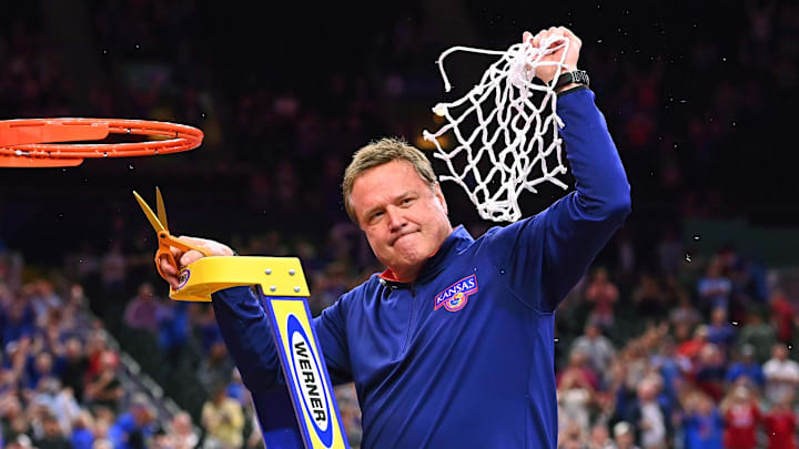 Kansas Jayhawks coach Bill Self cuts down the nets after defeating the North Carolina Tar Heels in the 2022 national championship at Caesars Superdome. 