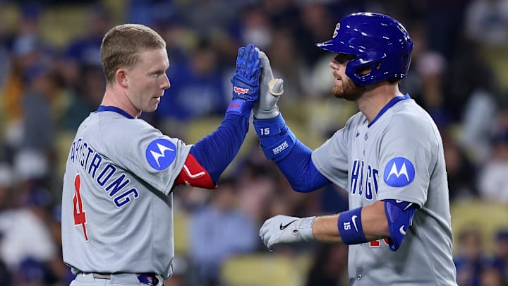 Apr 12, 2025; Los Angeles, California, USA; Chicago Cubs catcher Carson Kelly (15) reacts with outfielder Pete Crow-Armstrong (4) after hitting a two run home run against the Los Angeles Dodgers during the ninth inning at Dodger Stadium