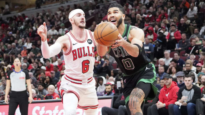 Mar 23, 2024; Chicago, Illinois, USA; Chicago Bulls guard Alex Caruso (6) defends Boston Celtics forward Jayson Tatum (0) during the second half at United Center. Mandatory Credit: David Banks-USA TODAY Sports Mar 23, 2024; Chicago, Illinois, USA; Chicago Bulls guard Alex Caruso (6) defends Boston Celtics forward Jayson Tatum (0) during the second half at United Center. Mandatory Credit: David Banks-USA TODAY Sports