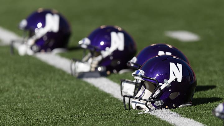 Sep 30, 2017; Madison, WI, USA; Northwestern Wildcats helmets on the field prior to the game against the Wisconsin Badgers at Camp Randall Stadium. Mandatory Credit: Jeff Hanisch-Imagn Images Sep 30, 2017; Madison, WI, USA; Northwestern Wildcats helmets on the field prior to the game against the Wisconsin Badgers at Camp Randall Stadium. Mandatory Credit: Jeff Hanisch-Imagn Images