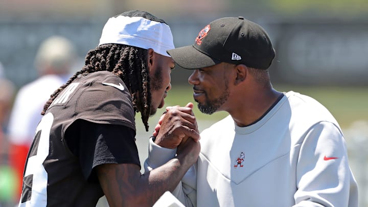 Browns cornerback Martin Emerson Jr. hugs cornerbacks coach Brandon Lynch after minicamp practice, Thursday, June 13, 2024, in Berea.