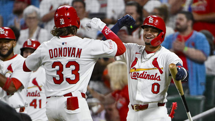 Jul 8, 2025; St. Louis, Missouri, USA;  St. Louis Cardinals left fielder Brendan Donovan (33) celebrates with shortstop Masyn Winn (0) after hitting a two run home run against the Washington Nationals during the third inning at Busch Stadium. Mandatory Credit: Jeff Curry-Imagn Images