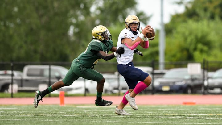 St. Joseph opens its football season by hosting Maryland's Our Lady of Good Counsel at Overpeck County Park in Palisades Park on Saturday August 28, 2021. SJ #20 Raquan Harvey and GC #5 Antonio Avery.

St Joseph Plays Our Lady Of Good Counsel