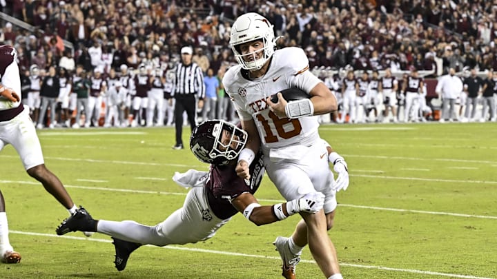 Texas Longhorns quarterback Arch Manning (16) breaks the attempted tackle from Texas A&M Aggies defensive back Marcus Ratcliffe (3) during the first half. 