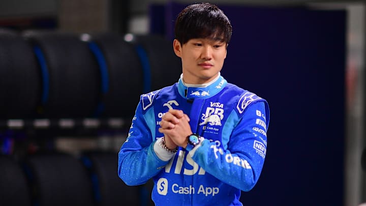 Nov 20, 2024; Las Vegas, Nevada, USA; Visa Cash App RB driver Yuki Tsunoda (22) poses for photos at Las Vegas Circuit. Mandatory Credit: Gary A. Vasquez-Imagn Images