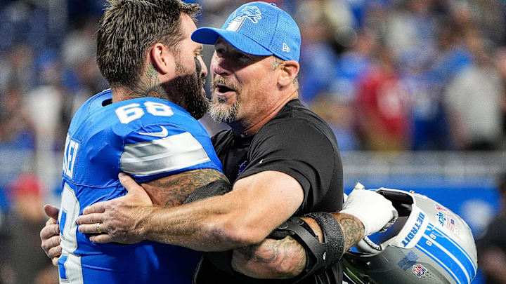 Detroit Lions head coach Dan Campbell hugs offensive tackle Taylor Decker (68) during warm up before the Tampa Bay Buccaneers game at Ford Field in Detroit on Sunday, September 15, 2024.