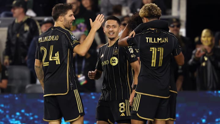 LAFC midfielder Marco Delgado (8) celebrates with teammates after scoring a goal against the Colorado Rapids during the second half of Concacaf Champions Cup Round 