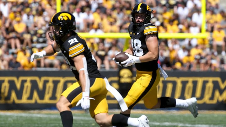 Iowa’s Zach Ortwerth (48) looks to gain extra yards after a catch against Illinois State Saturday, Aug. 31, 2024 at Kinnick Stadium in Iowa City, Iowa.