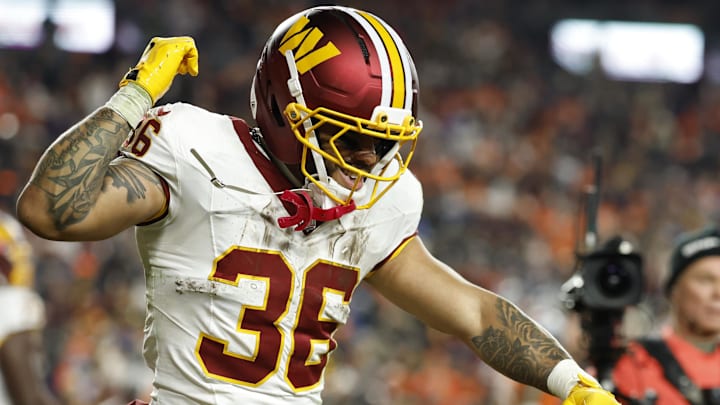 Washington Commanders running back Chris Rodriguez Jr. celebrates after scoring a touchdown against the Denver Broncos 