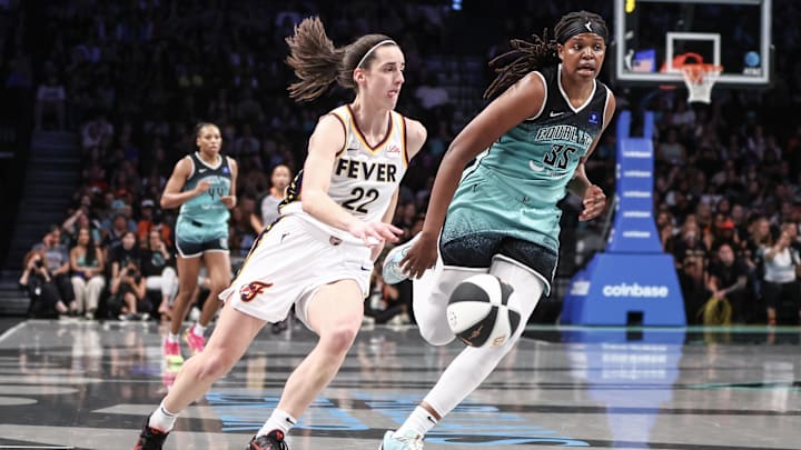Jun 2, 2024; Brooklyn, New York, USA; Indiana Fever guard Caitlin Clark (22) drives past New York Liberty forward Jonquel Jones (35) in the second quarter at Barclays Center. Mandatory Credit: Wendell Cruz-Imagn Images Jun 2, 2024; Brooklyn, New York, USA; Indiana Fever guard Caitlin Clark (22) drives past New York Liberty forward Jonquel Jones (35) in the second quarter at Barclays Center. Mandatory Credit: Wendell Cruz-Imagn Images
