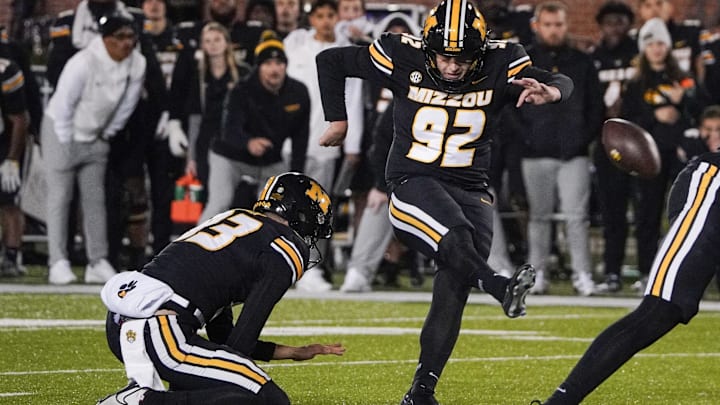 Nov 18, 2023; Columbia, Missouri, USA; Missouri Tigers place kicker Harrison Mevis (92) kicks the winning field goal against the Florida Gators during the second half at Faurot Field at Memorial Stadium. Mandatory Credit: Denny Medley-Imagn Images