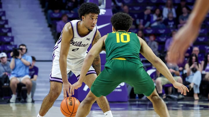 Feb 17, 2026; Manhattan, Kansas, USA; Kansas State Wildcats guard P.J. Haggerty (4) is guarded by Kansas State Wildcats guard David Castillo (10) during the first half at Bramlage Coliseum. 