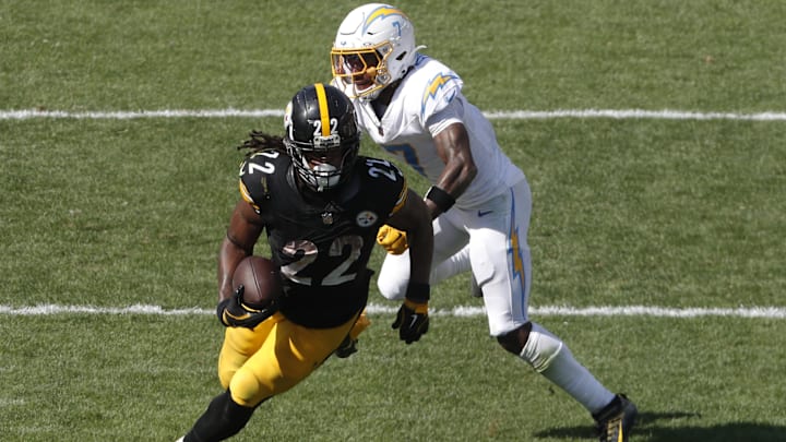 Pittsburgh Steelers running back Najee Harris carries the ball past Los Angeles Chargers cornerback Kristian Fulton during the fourth quarter at Acrisure Stadium. Pittsburgh Steelers running back Najee Harris carries the ball past Los Angeles Chargers cornerback Kristian Fulton during the fourth quarter at Acrisure Stadium.