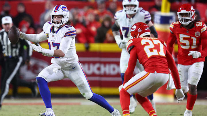 Buffalo Bills quarterback Josh Allen (17) rushes the ball past Kansas City Chiefs safety Chamarri Conner (27) Buffalo Bills quarterback Josh Allen (17) rushes the ball past Kansas City Chiefs safety Chamarri Conner (27)