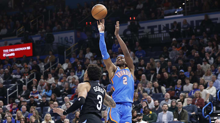 Oklahoma City Thunder guard Gilgeous-Alexander shoots over Utah Jazz guard George during the second quarter at Paycom Center. Oklahoma City Thunder guard Gilgeous-Alexander shoots over Utah Jazz guard George during the second quarter at Paycom Center.