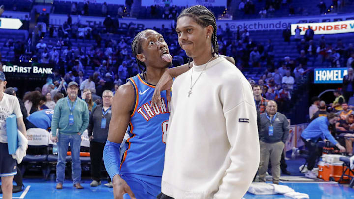 Jan 22, 2025; Oklahoma City, Oklahoma, USA; Oklahoma City Thunder forward Jalen Williams (8) reacts towards his brother Utah Jazz forward Cody Williams (5) after their game at Paycom Center. Mandatory Credit: Alonzo Adams-Imagn Images