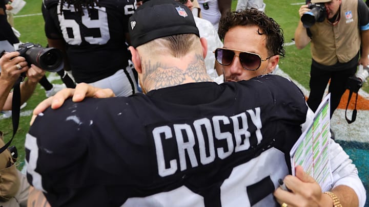 Nov 17, 2024; Miami Gardens, Florida, USA; Miami Dolphins head coach Mike McDaniel and Las Vegas Raiders defensive end Maxx Crosby (98) hug after the game at Hard Rock Stadium. Mandatory Credit: Sam Navarro-Imagn Images